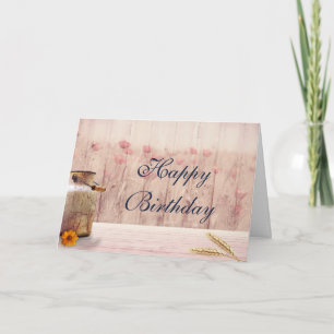 Rustige melk kan met tarwe en bloemen op zaterdag kaart