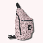 Sac À Bandoulière Fleurs et faces rose monogramme<br><div class="desc">Ce sac à élingue élégant est doté d'un motif de visages et de fleurs tout-en-un dessiné à la main et de votre monogramme initial à l'avant. Trois compartiments zippés peuvent facilement stocker vos clés, portefeuille, téléphone, appareil photo et bien plus encore. Portez-le comme carrosserie ou sur une épaule, et fixez...</div>
