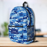Sac À Dos Imprimé Cool Camo Shark Motif Nom personnalisé Texte<br><div class="desc">Super fun sac à dos avec un motif de requin camouflage bleu et votre nom personnalisé. Ajoutez une ligne supplémentaire de texte - numéro de téléphone, nom de l'équipe, dire, etc. - ou supprimez. Assez spacieux pour les livres, l'ordinateur, l'équipement sportif et plus - ou comme un sac de voyage...</div>