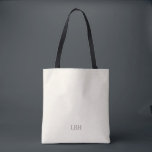 Sac à main tote pour demoiselle d'honneur, monogra<br><div class="desc">Un cadeau qu'elles emporteront partout— littéralement. Ce sac tote ivoire avec un monogramme gris épuré est suffisamment spacieux pour les essentiels du jour du mariage et suffisamment chic pour les courses quotidiennes. Un cadeau personnalisé pour demoiselle d'honneur qui est aussi pratique que beau.</div>