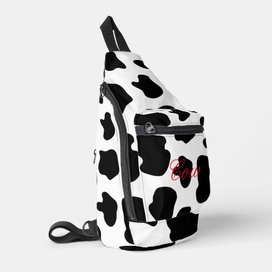Sac à roulettes à taches de vache noires et blanch (Coin gauche)