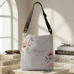 Sac Ajustable Blush Poppy Floral Bride | Elegant Personalized<br><div class="desc">Part of The Madinah Bloom Collection, this elegant crossbody design captures the softness of blush poppies in a composition that feels timeless, feminine, and quietly luxurious. A personalized name is delicately framed on the front, while the reverse features a refined monogram—creating a meaningful keepsake designed exclusively for her. The all-over-print...</div>