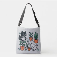 Chats noirs et blancs jardinant des plantes