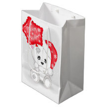 Ours blanc mignon avec ballon de Noël rouge