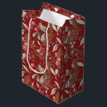 Sac Cadeau Moyen Rouge foncé Élégant verdure Noël botanique<br><div class="desc">Conçu dans des couleurs de Noël intemporelles de rouge riche, de vert vif et d'ivoire élégant, ce sac respire le charme des vacances. L'arrière - plan rouge foncé personnalisé ajoute une touche de sophistication, ce qui fait de votre cadeau un véritable démarque. Ce sac cadeau polyvalent est la touche finale...</div>