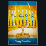 Sac Cadeau Moyen Yellow Gold Hanoukka Menorah Peace Love Light Bold<br><div class="desc">"Paix, amour et lumière." Une photo de fond illustrant une menorah d'art brillante, colorée, jaune et or vous aide à inaugurer les vacances d'Hanoukka dans le style. Sentez la chaleur et la joie de la saison des Fêtes chaque fois que vous utilisez ce sac cadeau personnalisé et amusant de taille...</div>