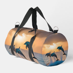 Sac De Sport Danse au crépuscule : Trois dauphins sautant 