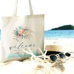 Sac fourre-tout de mariage de destination plage<br><div class="desc">Faites une déclaration élégante avec ce Sac fourre-tout de mariage de destination de plage, parfait pour votre fête côtière. Doté d'une aquarelle sereine aux teintes bleu, turquoise, turquoise et pêche, et de délicats accents floraux, il offre une ambiance chic et boho. Avec le mot "Bienvenue" dans un script élégant, ce...</div>