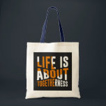 Sac fourre-tout d'unité - La vie est une question<br><div class="desc">Portez un message d'unité et de convivialité avec ce sac fourre-tout élégant. Doté d'un design audacieux et de l'expression "La vie est au sujet de l'unicité", ce sac est parfait pour tous ceux qui aiment la connexion et la communauté. Fabriqué à partir de matériaux de haute qualité, il est idéal...</div>