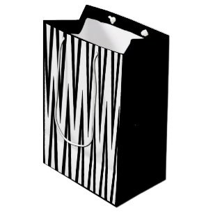 Sac noir et blanc moyen de cadeau