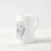 Saffy la tasse blanche de Cockapoo Chine (Devant droit)