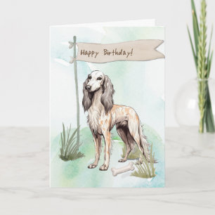 Saluki Hondenras buiten onder verjaardagsbord Kaart