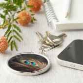 Samenstelling van heldere pauwenveren sleutelhanger (Zijkant)