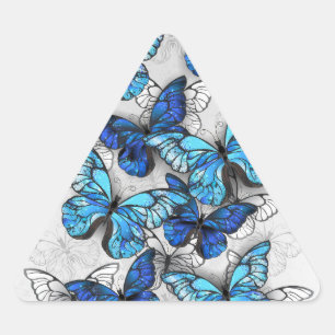 Samenstelling van witte en blauwe vlinders driehoek sticker