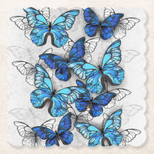 Samenstelling van witte en blauwe vlinders kartonnen onderzetters