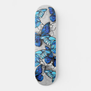 Samenstelling van witte en blauwe vlinders skateboard
