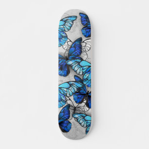 Samenstelling van witte en blauwe vlinders skateboard