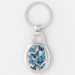Samenstelling van witte en blauwe vlinders sleutelhanger