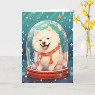 Samojed in een Kerstmis Sneeuwbol Fel Licht Kaart