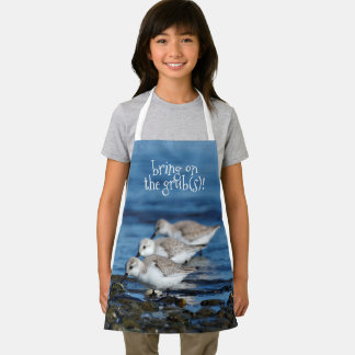 Sanderlings feesten in gespreide synchroniciteit schort