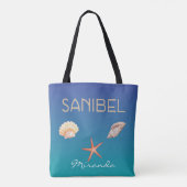 Sanibel met schelpen op blauw en aangepaste naam draagtas (Achterkant)