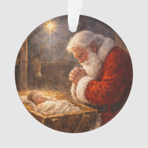 Santa agenouillé à la crèche de la Nativité