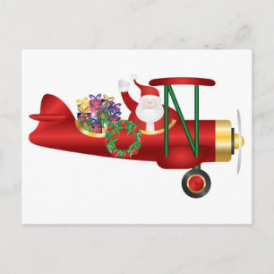 Santa Claus agitant sur Biplane avec carte postale