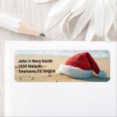 Santa Claus Pet op een tropisch strand Etiket (Insitu)