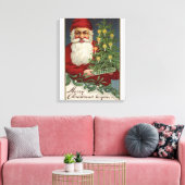 Santa Holding Candlelit Tree Canvas Afdruk (Insitu (Woonkamer))