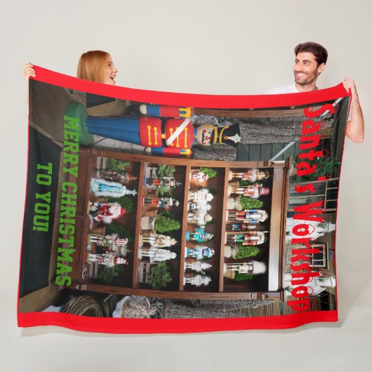 Santa's Workshop Nutcrackers Fleece Blanket (In situ)