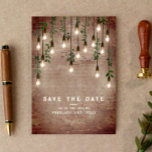 Save The Date Ampoules vintages Mariage botanique en brique rust<br><div class="desc">Lumières Edison vintages avec verdure botanique accrochées au-dessus de l'arrière - plan en brique patiné.</div>