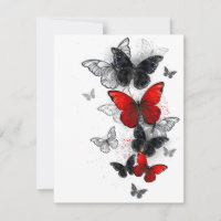 Papillons noirs et rouges volants