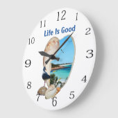 Scène de plage dans une horloge murale en coquilla (Angle)