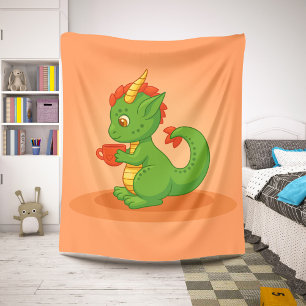 Schattige babyschaaldraak met beker op oranje sherpa deken