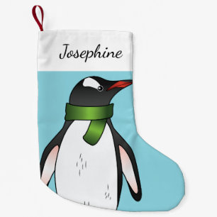 Schattige Gentoo-pinguïn met een groene sjaal op b Kleine Kerstsok
