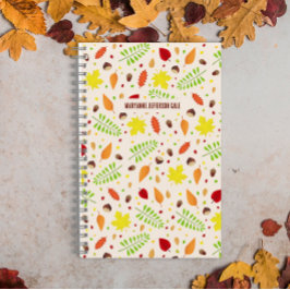 Schattige herfst met kleurrijke bladeren en noten notitieboek