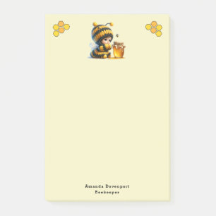 Schattige meisje in bijenkostuum met honing post-it® notes