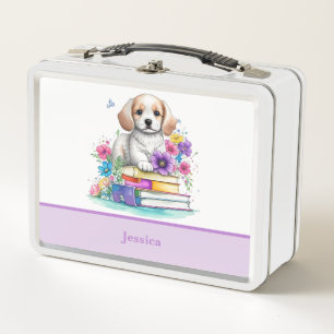 Schattige meisjesachtige puppy zittend op boeken e