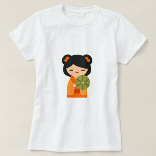 Schattige oranje Kokeshi Japanse poppen T-shirt