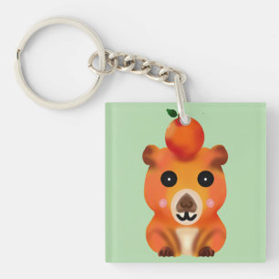 Schattige pluizige capybara met oranje   Kawaii di Sleutelhanger