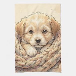 Schattige puppy gewikkeld in een gebreide deken theedoek