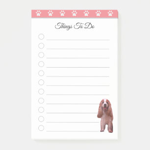 Schattige puppyhond op roze en witte dingen om te post-it® notes