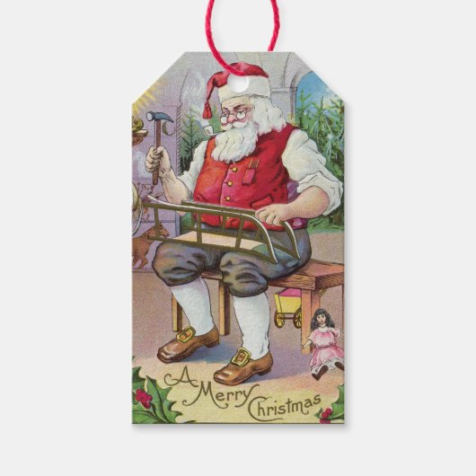 Schattige  Santa Making a Sled Gift Label Cadeaulabel (Voorkant)