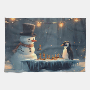 Schattige sneeuwman en pinguïn spelen schaken theedoek