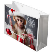 Schattigee aap met een kerstmuts groot cadeauzakje (Voorkant Gekanteld)