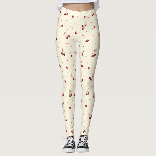 Schattigee Girly Roze Bogen en Kersen op Crème Leggings (Voorkant)