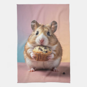 Schattigee hamster met chocolade chip muffin paste theedoek