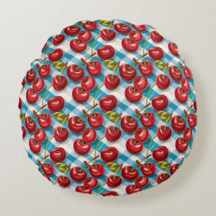 Schattigee kersen en blauw geplakt patroon rond kussen