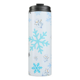 Schattigee sneeuwpoppen en sneeuwvlokken in lichtb thermosbeker