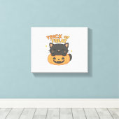 Schattigee zwarte kat in pompoen – Trick or treat  Canvas Afdruk (Insitu (Houten vloer))